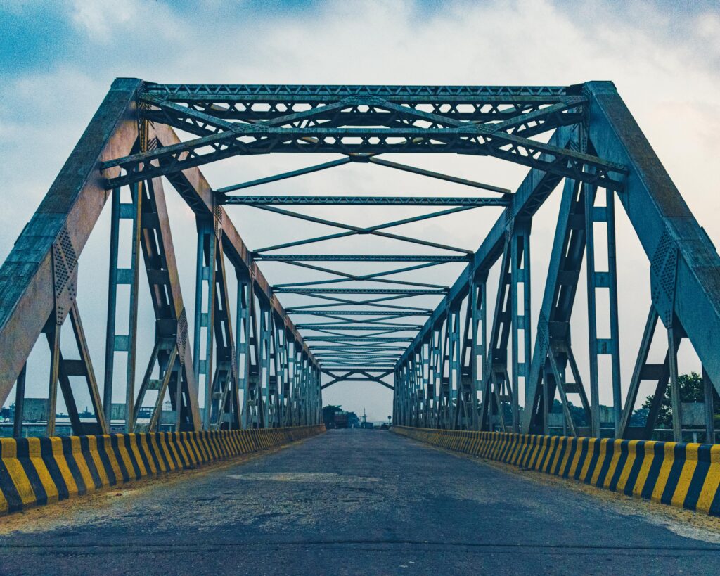 Symmetrical steel bridge representing the structural strength of robust leadership